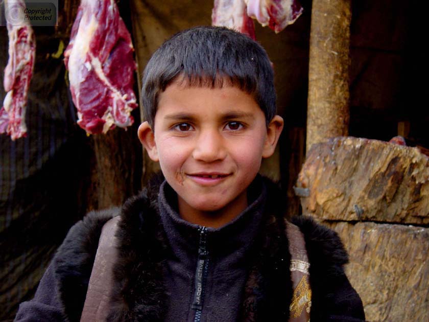 Boy in Front of Meat in Rokha